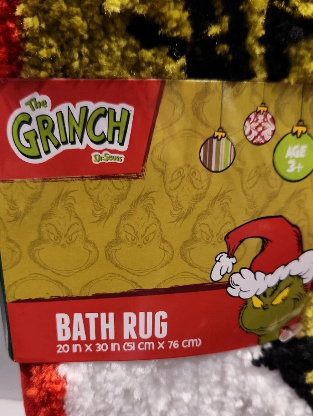 Dr. Seuss The Grinch White & Red Plush Bath Mat with Yellow Motif